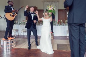 A man and woman in a wedding dress.